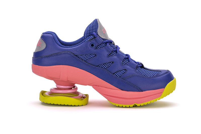 Purple and pink sneaker with a unique sole design on a white background